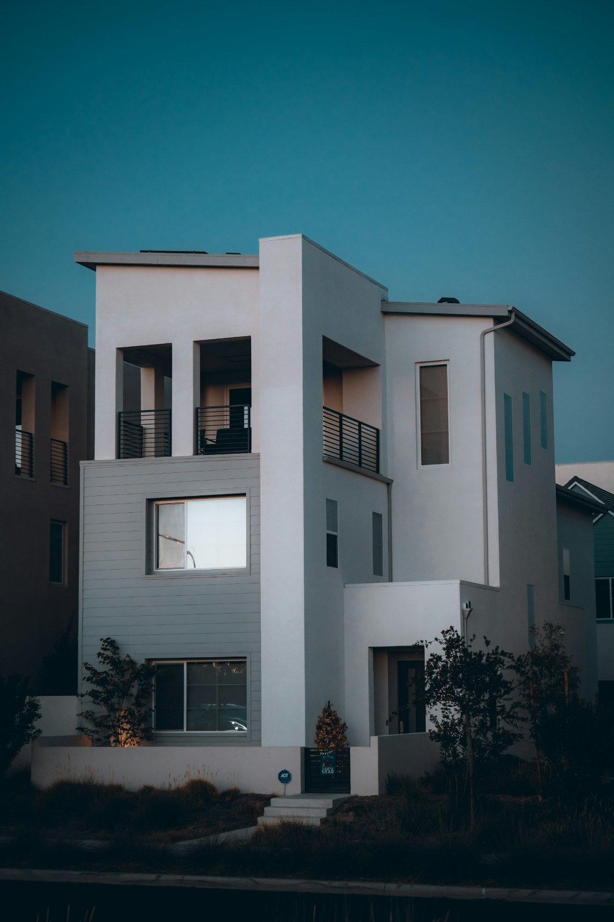 A contemporary villa exterior at dusk